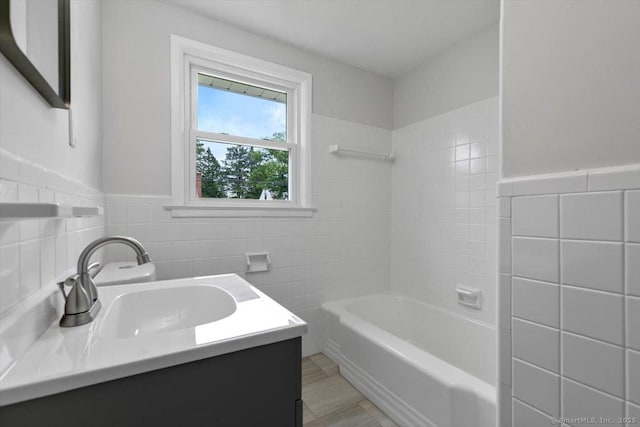 230 Green Rd, Manchester, CT 06042 - full bathroom with tile walls, vanity, and wainscoting