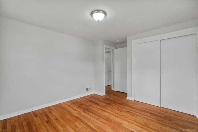 230 Green Rd, Manchester, CT 06042 - unfurnished bedroom with light wood-type flooring and a closet