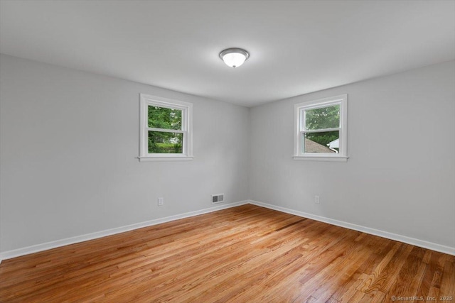 230 Green Rd, Manchester, CT 06042 - empty room with baseboards and light wood-style flooring