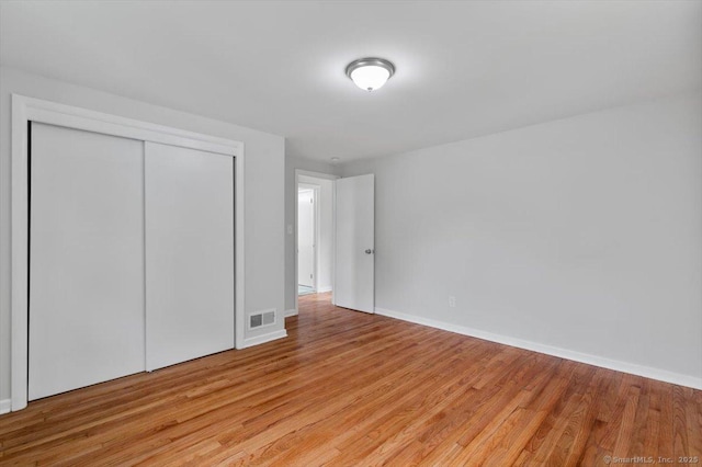 230 Green Rd, Manchester, CT 06042 - unfurnished bedroom featuring light wood-style flooring and a closet
