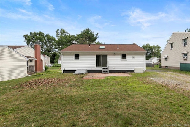 230 Green Rd, Manchester, CT 06042 - back of property with entry steps, a lawn, and a patio