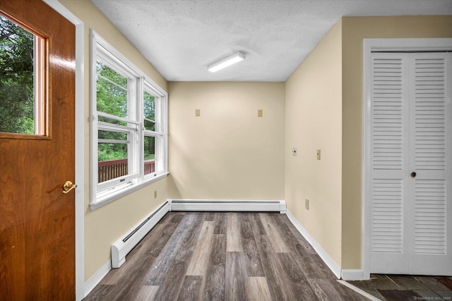 24 Iron Gate Ln, Cromwell, CT 06416 - unfurnished room with a baseboard radiator, dark wood finished floors, and a textured ceiling