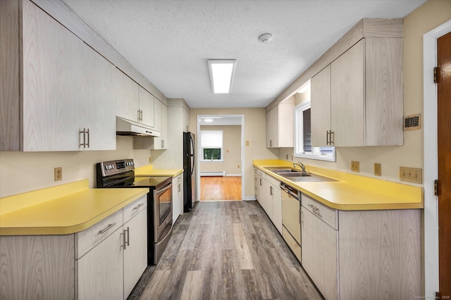 24 Iron Gate Ln, Cromwell, CT 06416 - kitchen with electric range, under cabinet range hood, wood finished floors, light countertops, and a textured ceiling