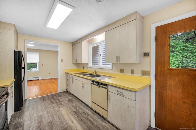 24 Iron Gate Ln, Cromwell, CT 06416 - kitchen with dishwasher, baseboard heating, light countertops, wood finished floors, and freestanding refrigerator