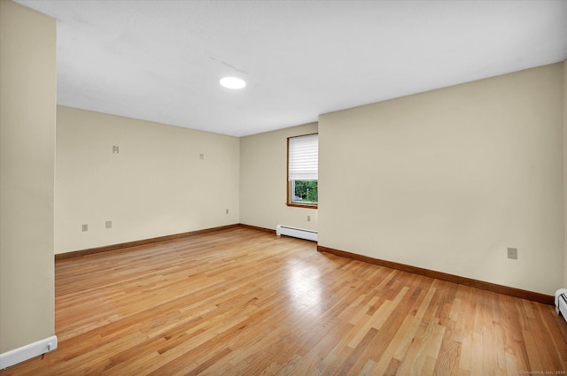 24 Iron Gate Ln, Cromwell, CT 06416 - empty room with baseboard heating and light wood-style flooring