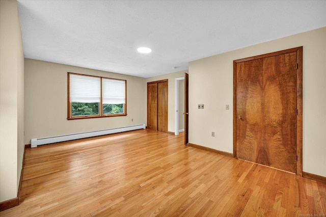24 Iron Gate Ln, Cromwell, CT 06416 - unfurnished bedroom with a baseboard heating unit, light wood-style flooring, and recessed lighting