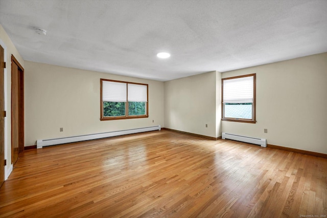 24 Iron Gate Ln, Cromwell, CT 06416 - empty room with baseboard heating, a smoke detector, and light wood-style floors