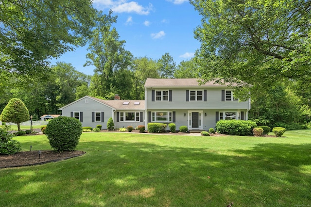 33 Shawnee Ln, Monroe, CT 06468 - colonial-style house featuring a front lawn and a chimney