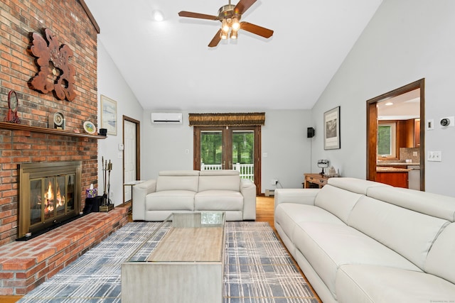 33 Shawnee Ln, Monroe, CT 06468 - living area with a wall unit AC, a ceiling fan, a brick fireplace, high vaulted ceiling, and wood finished floors