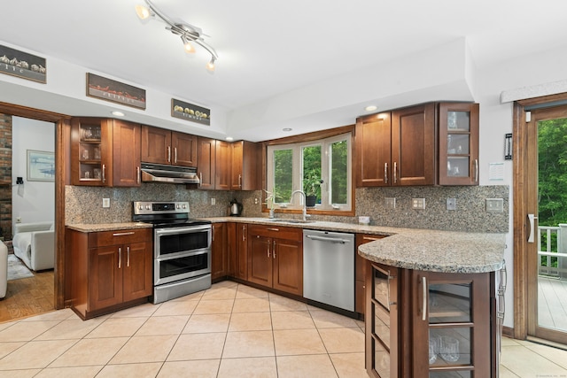 33 Shawnee Ln, Monroe, CT 06468 - kitchen featuring stainless steel appliances, under cabinet range hood, tasteful backsplash, and light stone counters