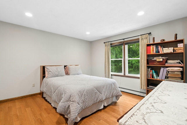 33 Shawnee Ln, Monroe, CT 06468 - bedroom featuring baseboard heating, light wood-style floors, and recessed lighting