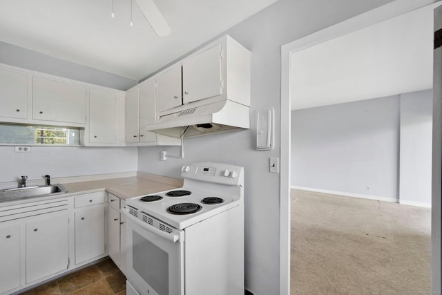 80 Cartright St Unit 8E, Bridgeport, CT 06604 - kitchen with electric range, under cabinet range hood, light countertops, white cabinetry, and dark carpet