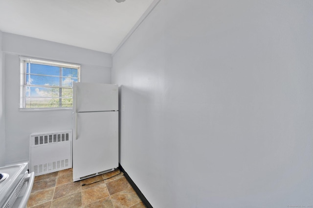 80 Cartright St Unit 8E, Bridgeport, CT 06604 - kitchen with freestanding refrigerator, radiator, range, and light stone finish flooring