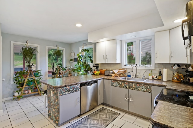 5 Legion Rd, Seymour, CT 06483 - kitchen featuring appliances with stainless steel finishes, a peninsula, light tile patterned floors, backsplash, and recessed lighting
