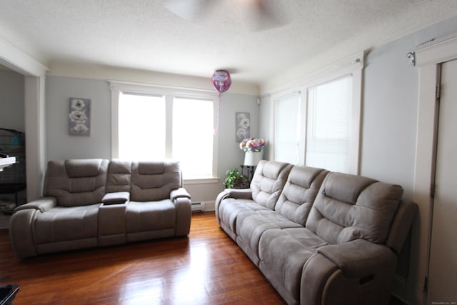 180 Victoria Rd, Hartford, CT 06114 - living room with wood finished floors, a baseboard heating unit, and a textured ceiling