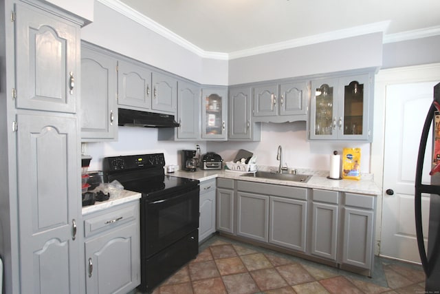 180 Victoria Rd, Hartford, CT 06114 - kitchen with black electric range, under cabinet range hood, gray cabinetry, crown molding, and glass insert cabinets
