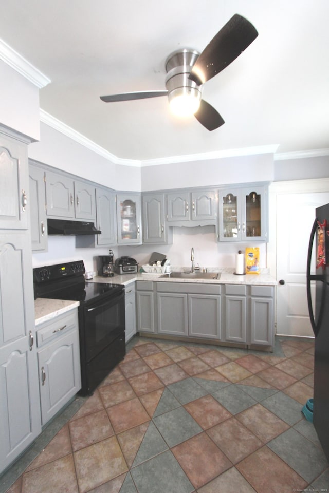 180 Victoria Rd, Hartford, CT 06114 - kitchen with black electric range, under cabinet range hood, gray cabinetry, crown molding, and freestanding refrigerator