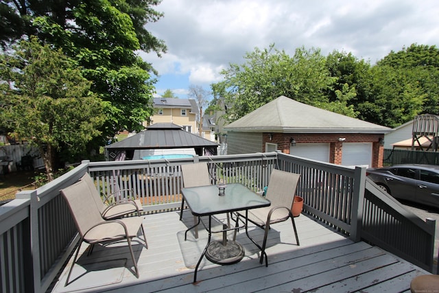180 Victoria Rd, Hartford, CT 06114 - deck with a gazebo, outdoor dining space, and a garage
