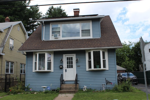 180 Victoria Rd, Hartford, CT 06114 - view of front of house featuring entry steps, a chimney, roof with shingles, and cooling unit