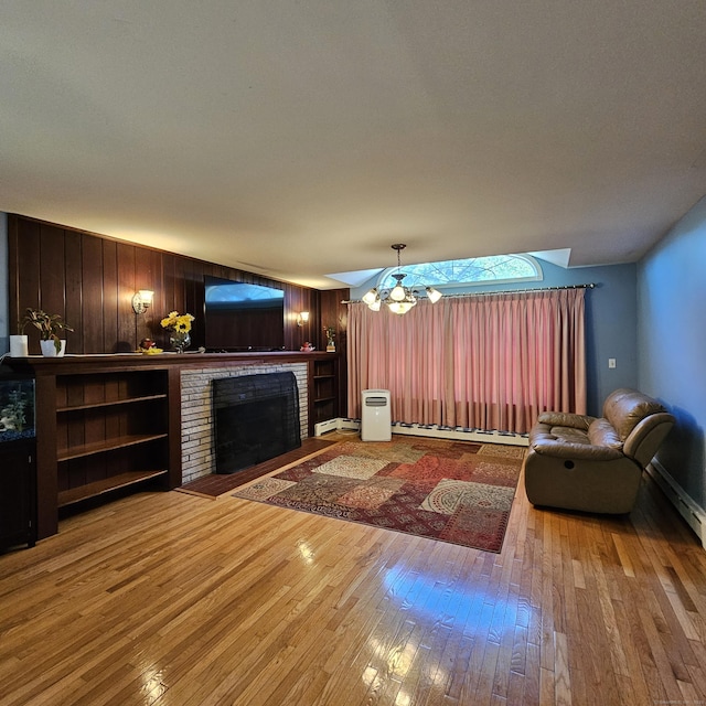50 Meadow St, Meriden, CT 06451 - living area with hardwood / wood-style flooring, a fireplace, wooden walls, and baseboard heating