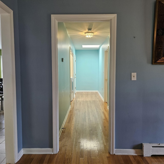 50 Meadow St, Meriden, CT 06451 - corridor featuring baseboard heating and hardwood / wood-style floors