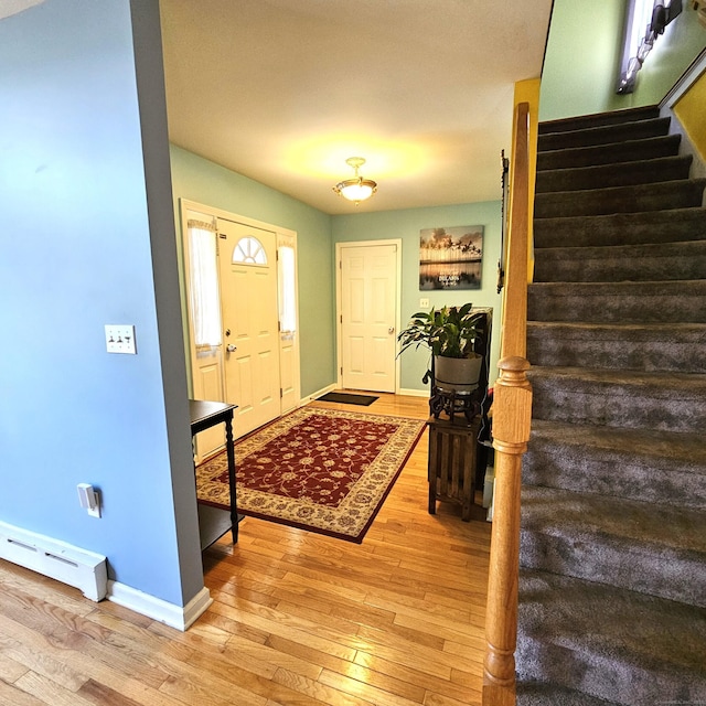 50 Meadow St, Meriden, CT 06451 - entryway featuring stairs, light wood-type flooring, and a baseboard radiator