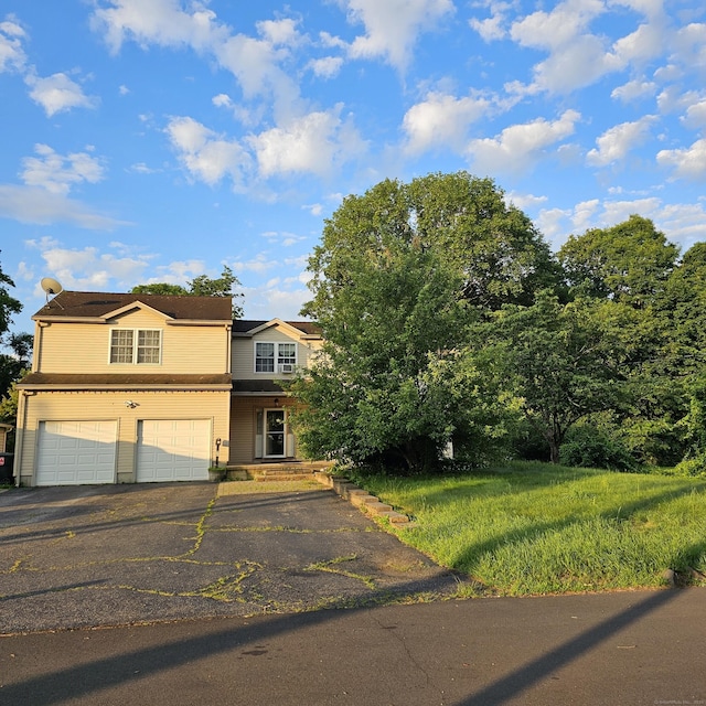 50 Meadow St, Meriden, CT 06451 - view of front of property with a garage and driveway