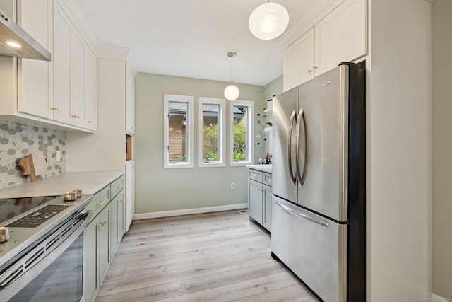 28 Biltmore Park Unit 28, Bloomfield, CT 06002 - kitchen featuring appliances with stainless steel finishes, under cabinet range hood, light wood finished floors, decorative backsplash, and light countertops