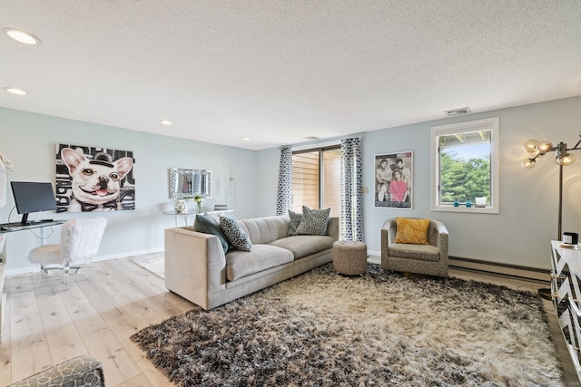 28 Biltmore Park Unit 28, Bloomfield, CT 06002 - living room with baseboard heating, hardwood / wood-style floors, a textured ceiling, and recessed lighting