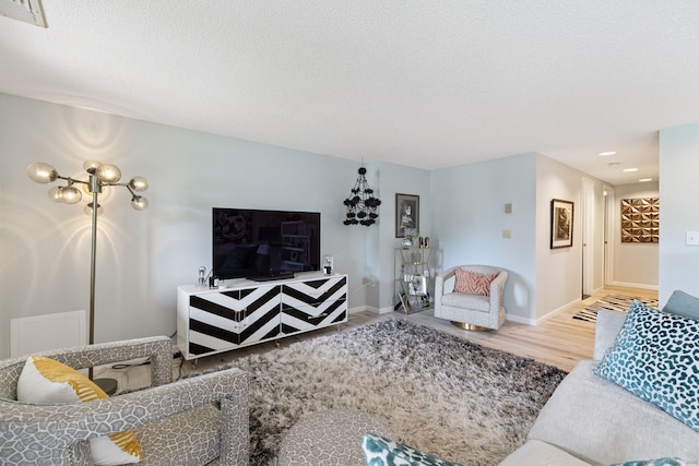 28 Biltmore Park Unit 28, Bloomfield, CT 06002 - living area featuring wood finished floors and a textured ceiling