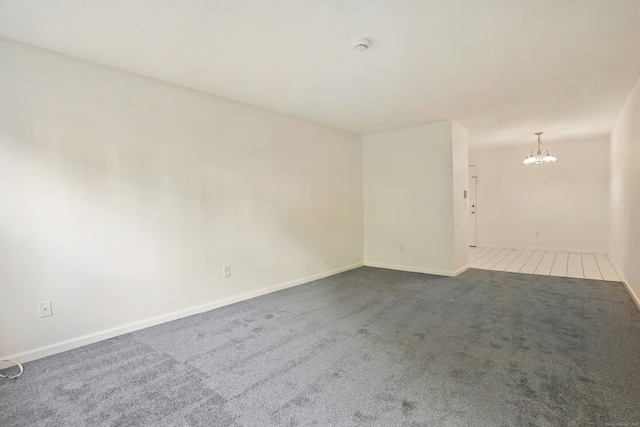 34A Padanaram Ave Unit 120, Danbury, CT 06811 - spare room with dark carpet, a chandelier, and a smoke detector