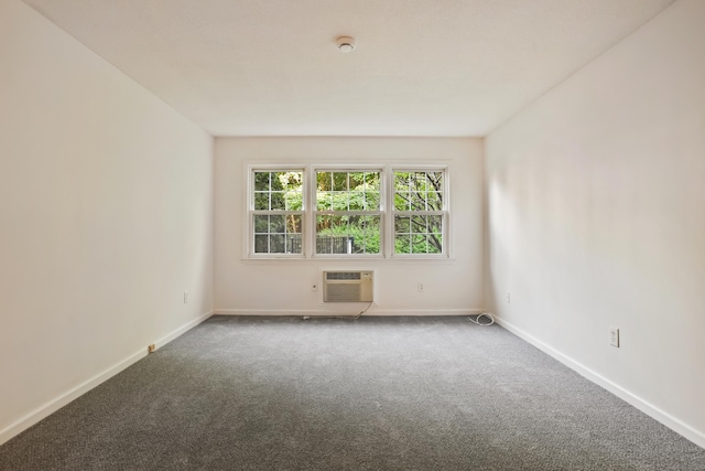 34A Padanaram Ave Unit 120, Danbury, CT 06811 - spare room featuring an AC wall unit, carpet floors, and a smoke detector