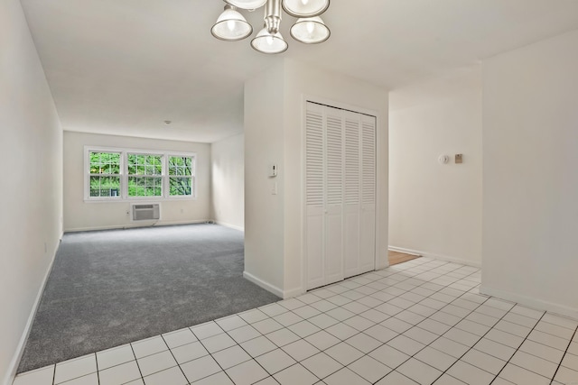 34A Padanaram Ave Unit 120, Danbury, CT 06811 - spare room with a chandelier, a wall mounted AC, and light colored carpet
