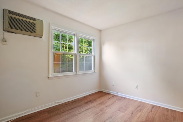 34A Padanaram Ave Unit 120, Danbury, CT 06811 - empty room featuring a wall mounted AC and light wood-style floors