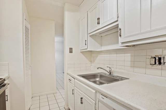 34A Padanaram Ave Unit 120, Danbury, CT 06811 - kitchen featuring light tile patterned floors, light countertops, tasteful backsplash, and white cabinetry