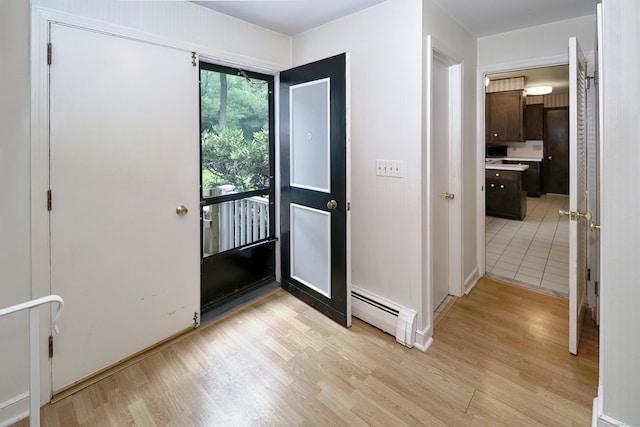 355 Surrey Ln, Fairfield, CT 06824 - foyer with a baseboard heating unit and light wood-style flooring