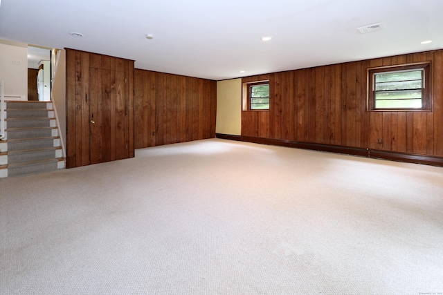 355 Surrey Ln, Fairfield, CT 06824 - carpeted empty room with wooden walls and stairs