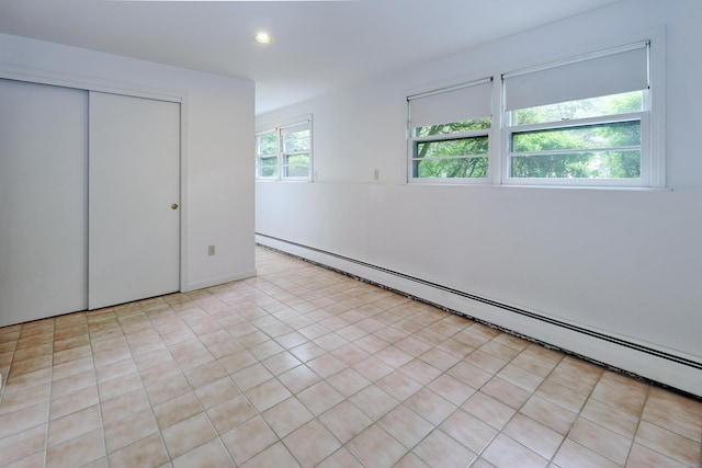 355 Surrey Ln, Fairfield, CT 06824 - unfurnished bedroom featuring baseboard heating, recessed lighting, and a closet