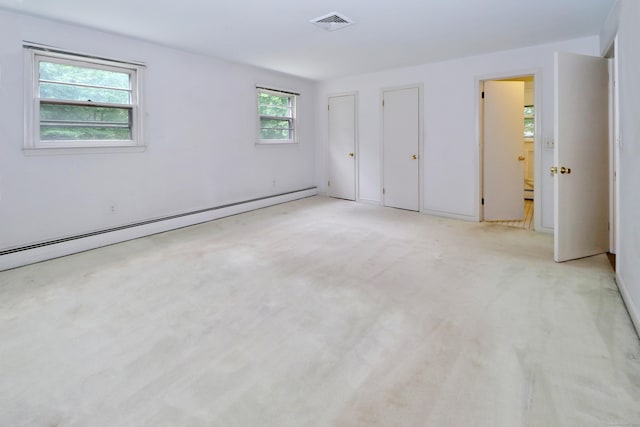 355 Surrey Ln, Fairfield, CT 06824 - unfurnished bedroom featuring a baseboard heating unit and light carpet