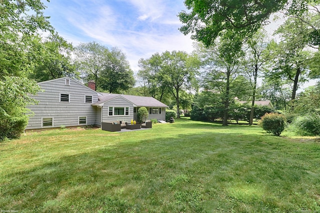 355 Surrey Ln, Fairfield, CT 06824 - view of green lawn with outdoor lounge area and view of scattered trees