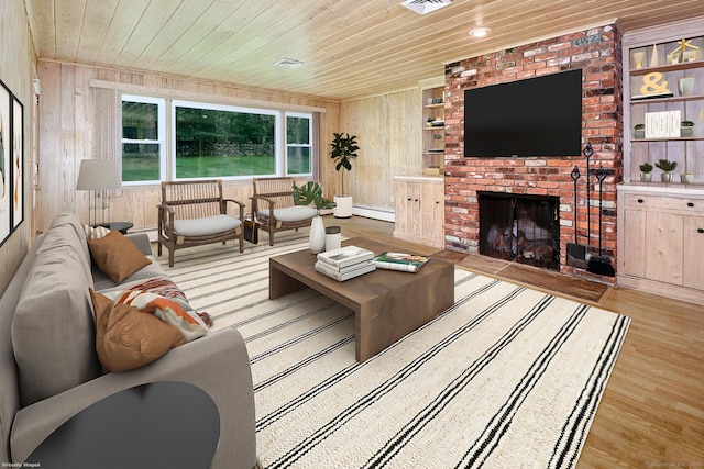 355 Surrey Ln, Fairfield, CT 06824 - living room with wood ceiling, wood walls, wood finished floors, a baseboard radiator, and a fireplace