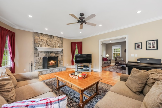 28 Sunnyview Dr, Redding, CT 06896 - living room featuring recessed lighting, wood finished floors, a ceiling fan, a stone fireplace, and crown molding