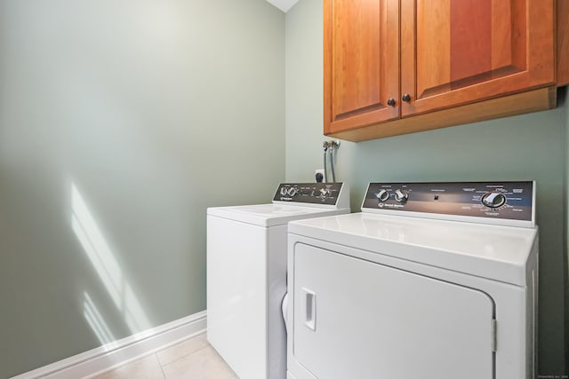 28 Sunnyview Dr, Redding, CT 06896 - laundry area featuring cabinet space, light tile patterned floors, and separate washer and dryer
