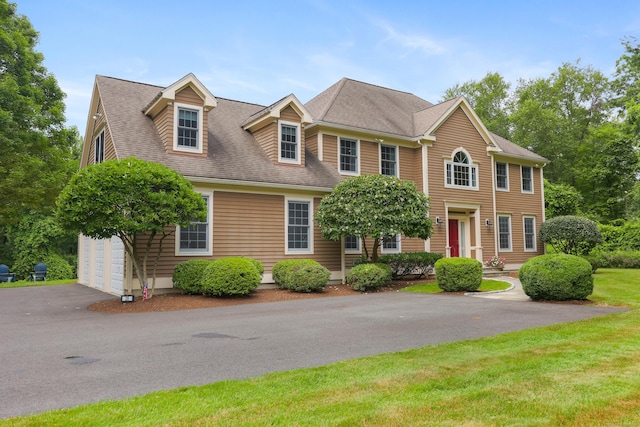 28 Sunnyview Dr, Redding, CT 06896 - view of front facade featuring a garage, a shingled roof, and driveway