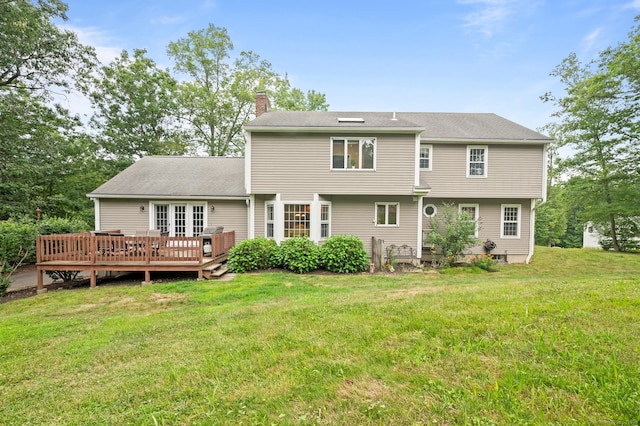 70 Shane Dr, Southbury, CT 06488 - back of house with a chimney, a wooden deck, and a yard