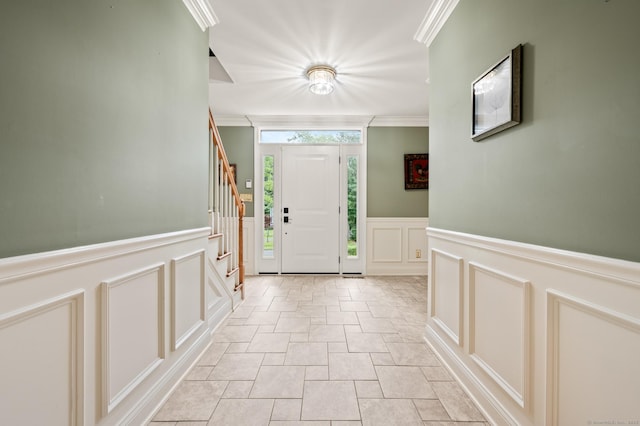 70 Shane Dr, Southbury, CT 06488 - foyer with a decorative wall, wainscoting, ornamental molding, stairway, and light stone finish floors