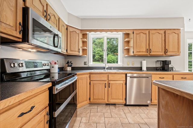 70 Shane Dr, Southbury, CT 06488 - kitchen with stainless steel appliances, open shelves, and dark countertops