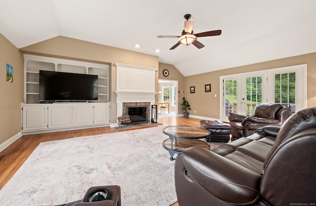70 Shane Dr, Southbury, CT 06488 - living area featuring lofted ceiling, a ceiling fan, light wood-style floors, and a fireplace
