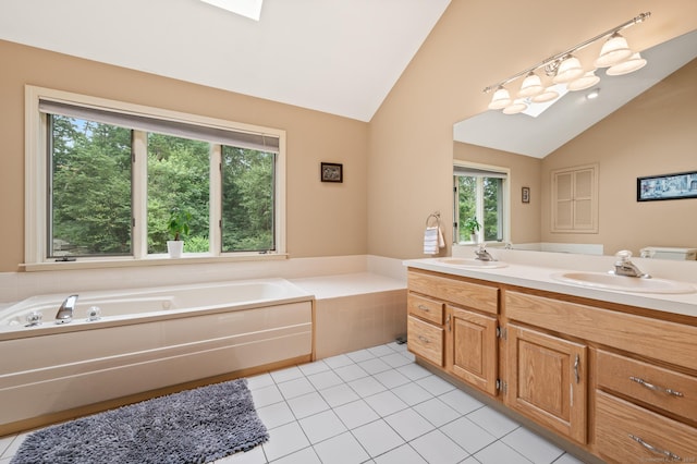 70 Shane Dr, Southbury, CT 06488 - full bathroom with vaulted ceiling, double vanity, a garden tub, tile patterned floors, and a skylight
