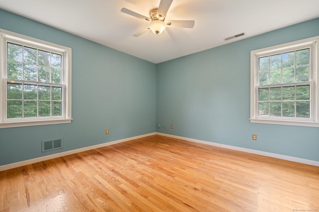 70 Shane Dr, Southbury, CT 06488 - unfurnished room featuring plenty of natural light, wood finished floors, and a ceiling fan